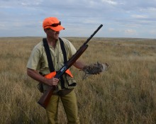 Hunter with sharptail grouse
